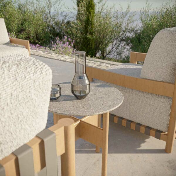 Image of detail of Natura garden sofa's iroko frame, tactile cushions and ceramic table top by Oiside
