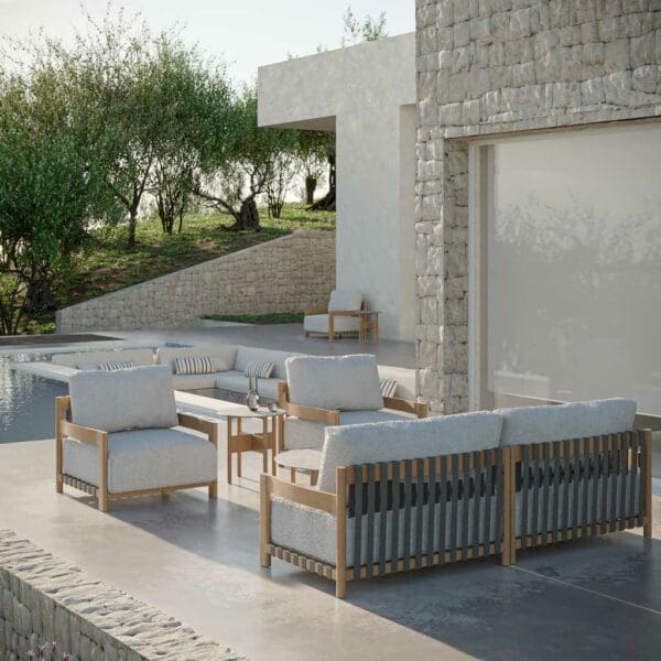 Image of Natura minimalist wood garden sofa and chairs by Oiside on terrace in the late afternoon sun