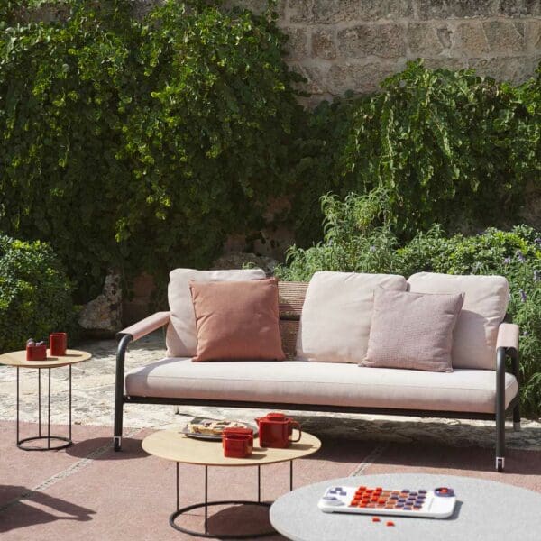 Image of Astra reclining garden sofa, Zefiro and Aspic low tables on sunny terrace fitted with outdoor rugs.