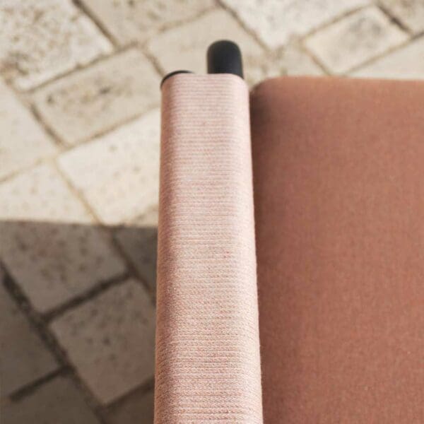 Image of detail of acrylic cord bound arm and snug seat cushion of Astra luxury garden furniture