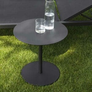 Image of RODA Button side table with carafe and glass of water on the table top