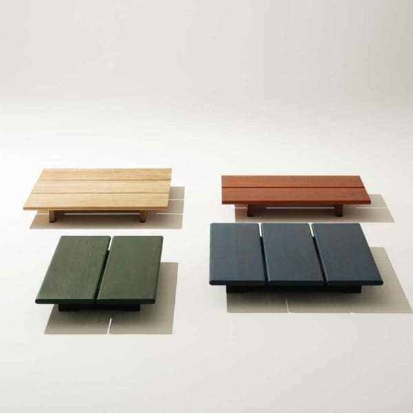 Studio image showing different colour finishes of Eolie iroko outdoor tables by RODA