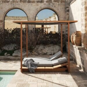 Image of Eolie pergola and integrated sun loungers by RODA on rustic Italian poolside
