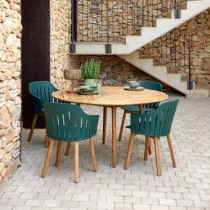 Image of Cane-line Define circular teak table with Choice recycled plastic garden chairs