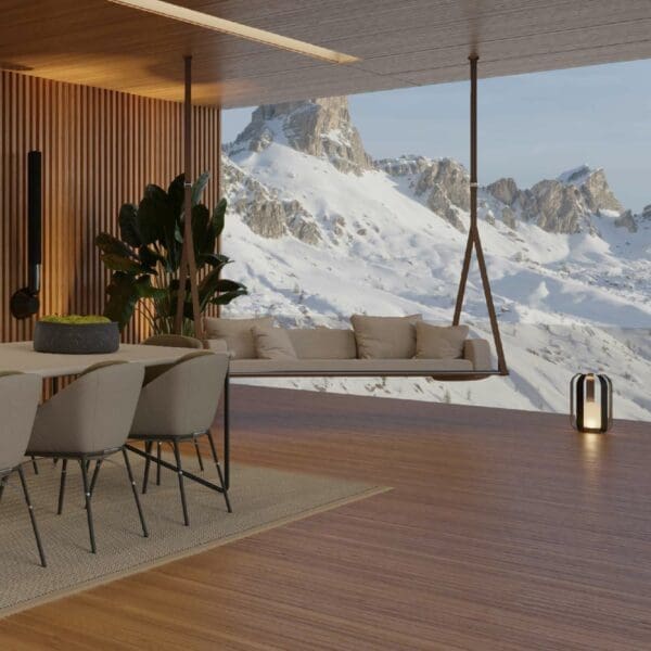 Image of Fable 3 seat hanging sofa swing inside opulent dwelling with snow-covered mountainside in the background