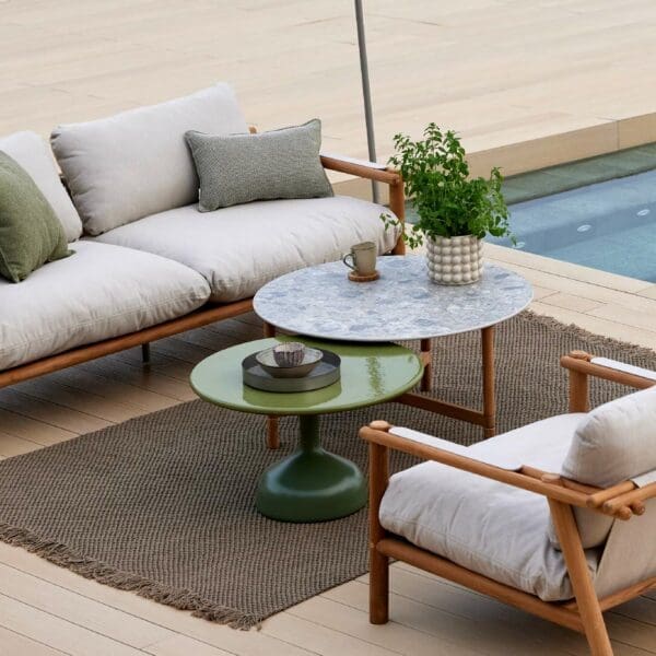 Image of Cane-line Glaze contemporary outdoor low tables and Sticks teak sofa and lounge chairs