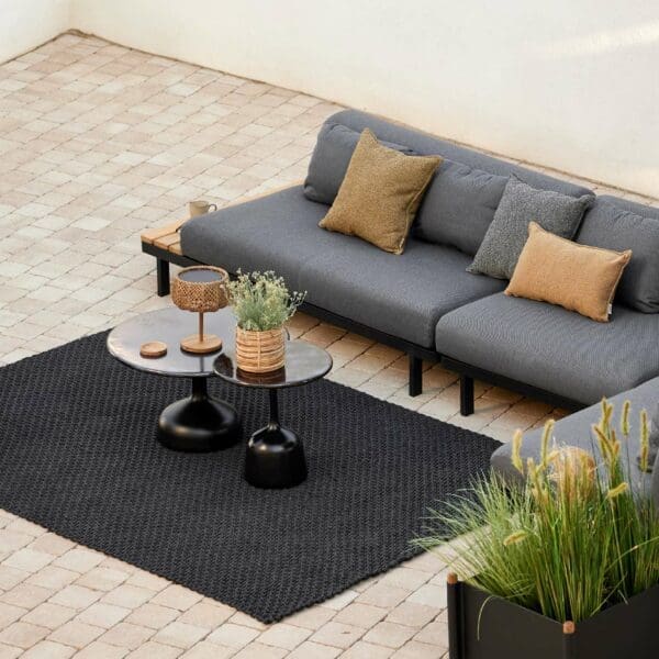 Image of bird's eye view of Space garden corner sofa, with Knot rug and Glaze coffee tables
