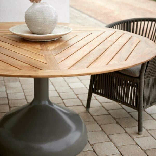 Image of detail of Glaze table's geometric teak top and Derby chair's Cane-line Softrope cord surfaces