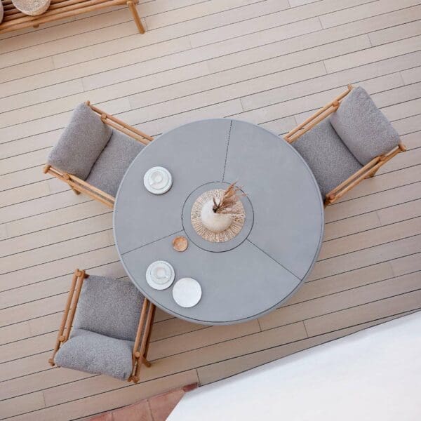 Image of bird's eye view of Glaze round garden dinner table together with Sticks teak dining chairs