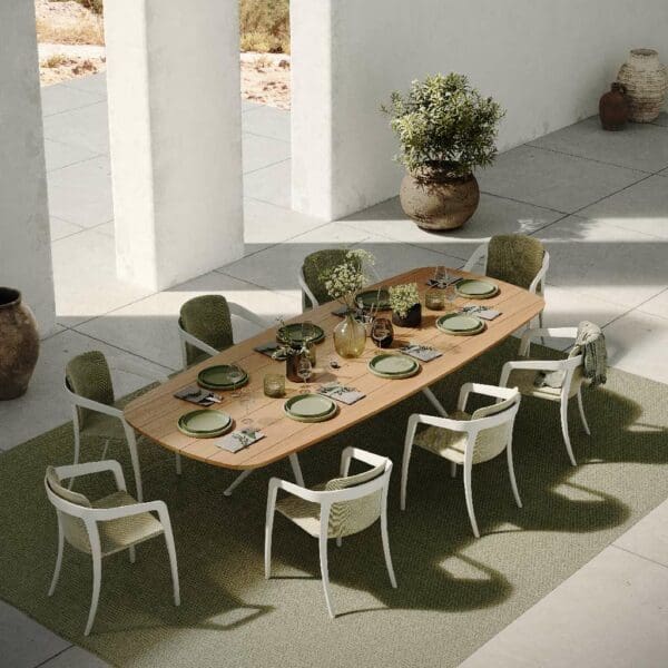 Image of birdseye view of Styletto white garden table with teak top together with Jive contemporary garden dining chairs by Royal Botania
