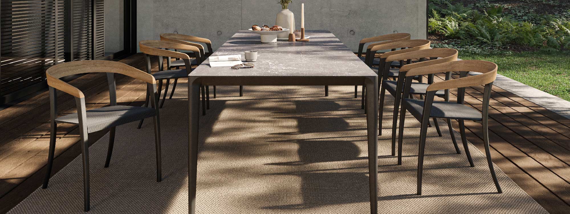 Image of Jive modern garden chairs around U-nite luxury dining table by Royal Botania