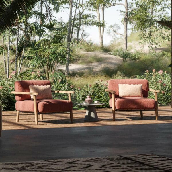 Image of pair of Mambo Lounge modern teak relax chairs with luxuriously deep cushions in a red fabric.