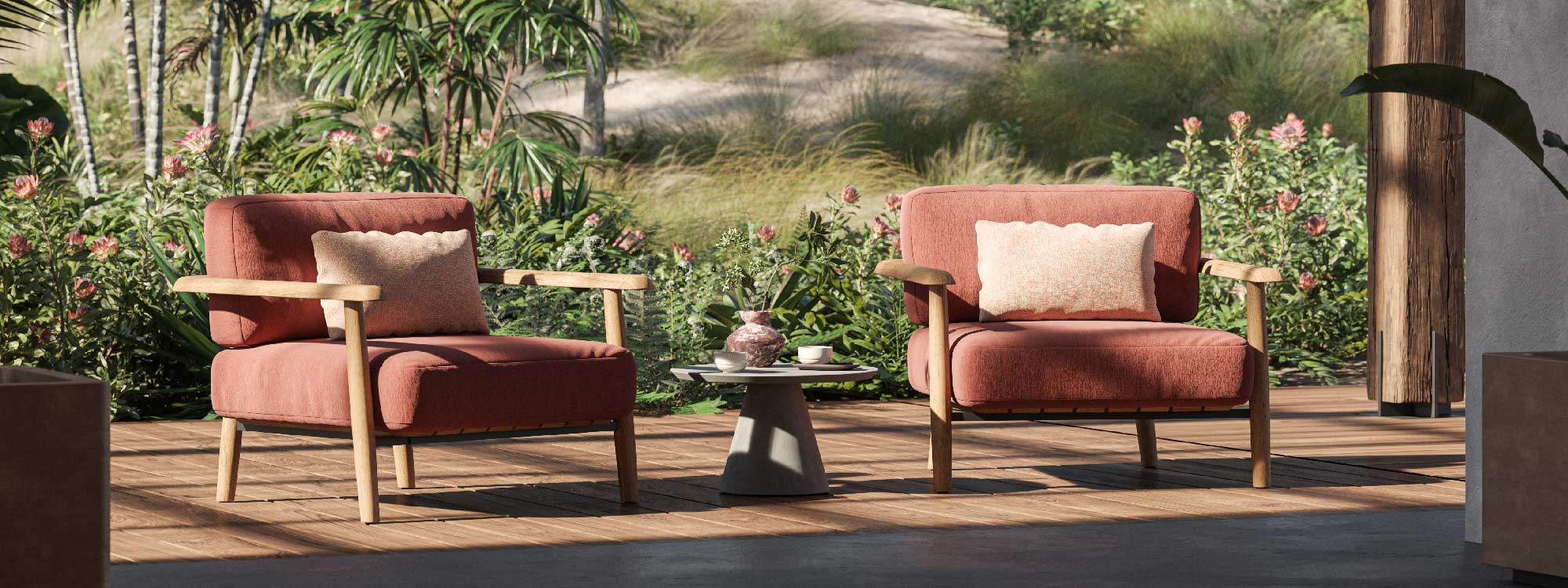 Image of pair of Royal Botania Mambo Lounge teak relax chairs with plump red cushions, next to Conix concrete side table
