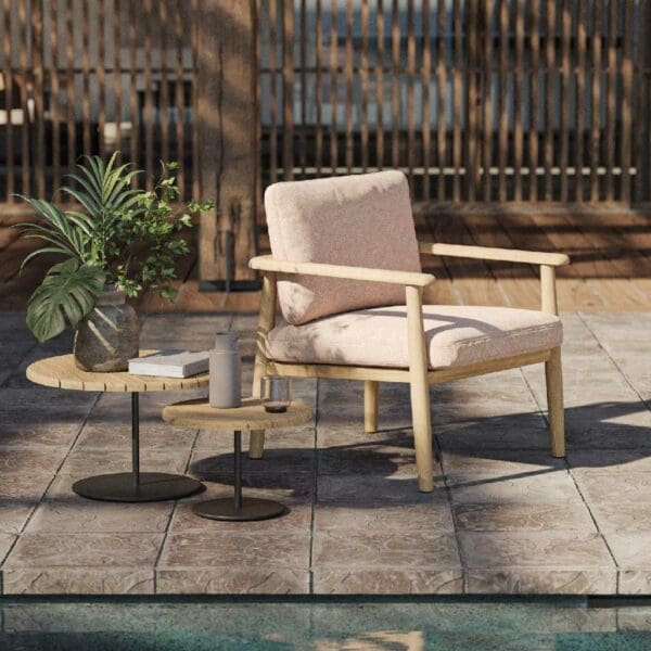 Image of Mambo contemporary teak lounge chair and Butler side table by Royal Botania