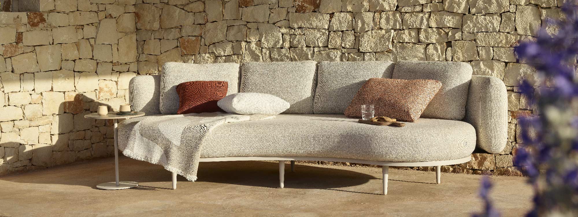 Image of Organix Contemporary Gardne Sofa in front of a cobbled wall