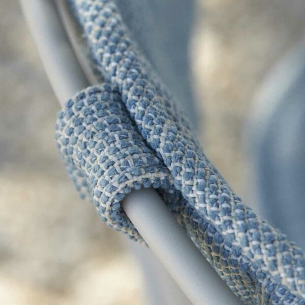 Image of detail of Ostrea furniture's tubular stainless steel frame and luxury cushion fabric by Royal Botania
