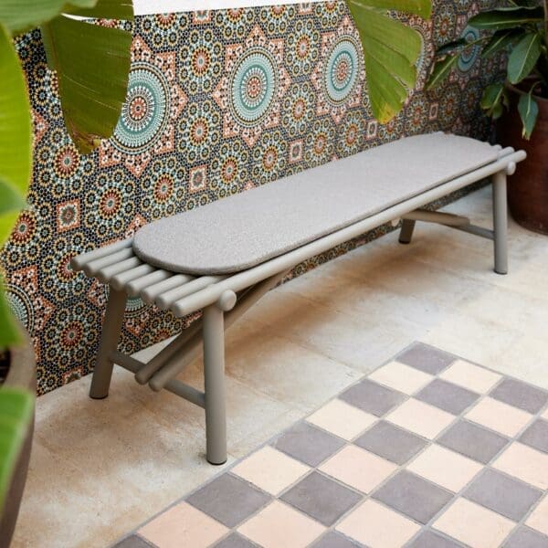 Image of Cane-line Sticks bench seat and cushion on tiled floor