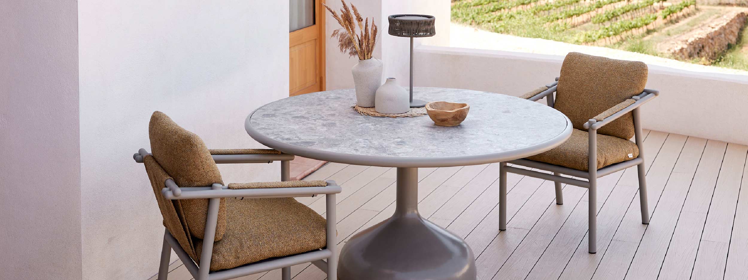 Image of Sticks aluminium garden chairs and Glaze round dining table by Cane-line