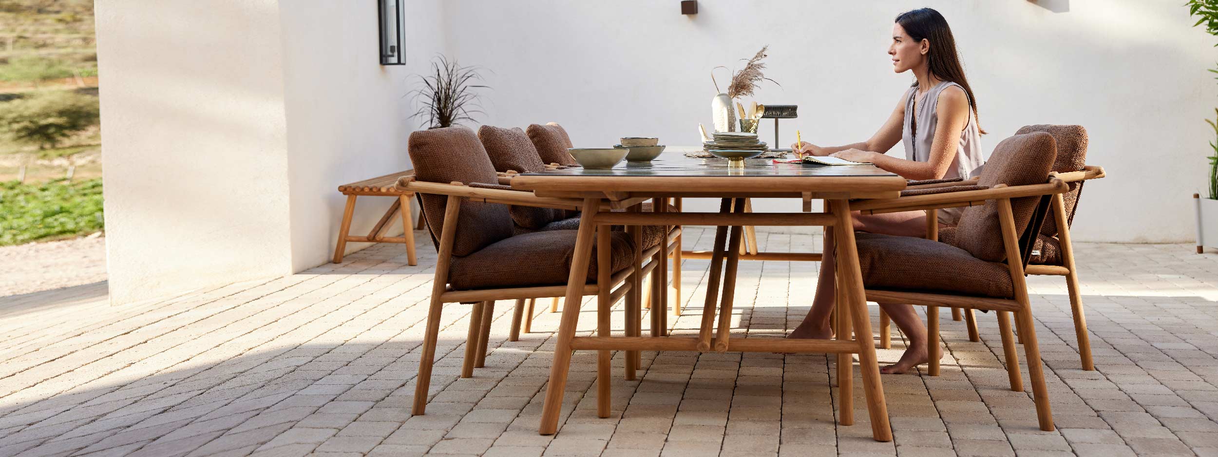 Image of Sticks FSC teak garden dining set with Umber Brown cushions by Cane-line