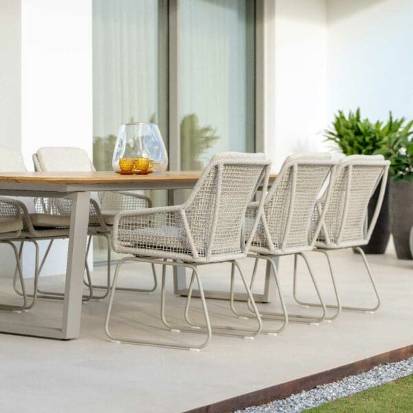 Image of Durham taupe garden table with teak top and Alden taupe outdoor dining chairs