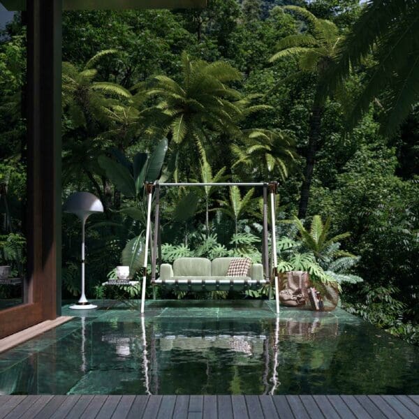 Image of Fable contemporary sofa swing seat and stand on plush marble poolside with exotic plants in the background