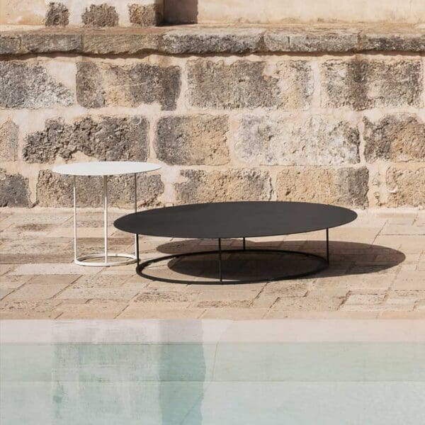 Image showing slender architectural design of Zefiro circular outdoor lounge table by RODA