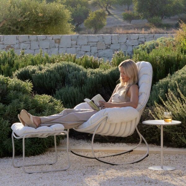 Image of woman luxuriating in deeply cushioned Folia garden rocking chair by Royal Botania