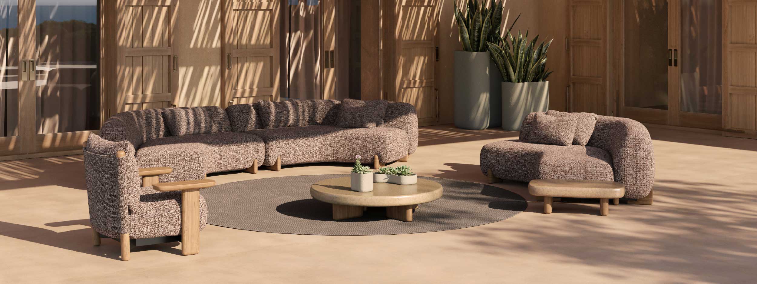 Image of Milos semi-circle garden sofa and upholstered lounge chairs around round concrete table on sunny terrace