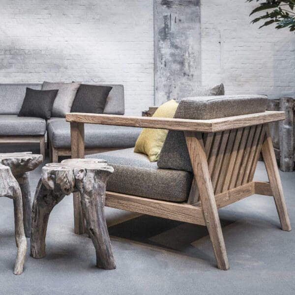 Image of Gommaire Copenhague lounge chair with grey cushions with wooden crafted coffee table