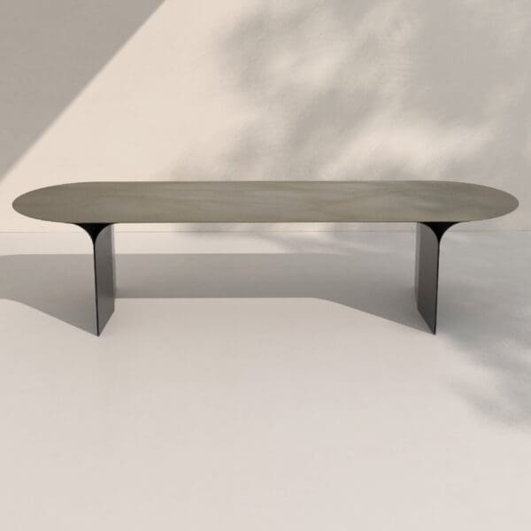Imagge of Arcs garden table by Joli with light and shadow playing in the white background