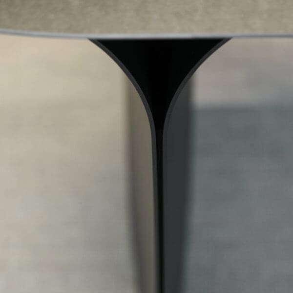 Image of detail of shaped aluminium base of Arcs garden table by Joli furniture