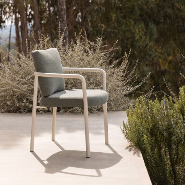 Image of Kori modern garden dining chair on sunny terrrace with rosemary plant to the side