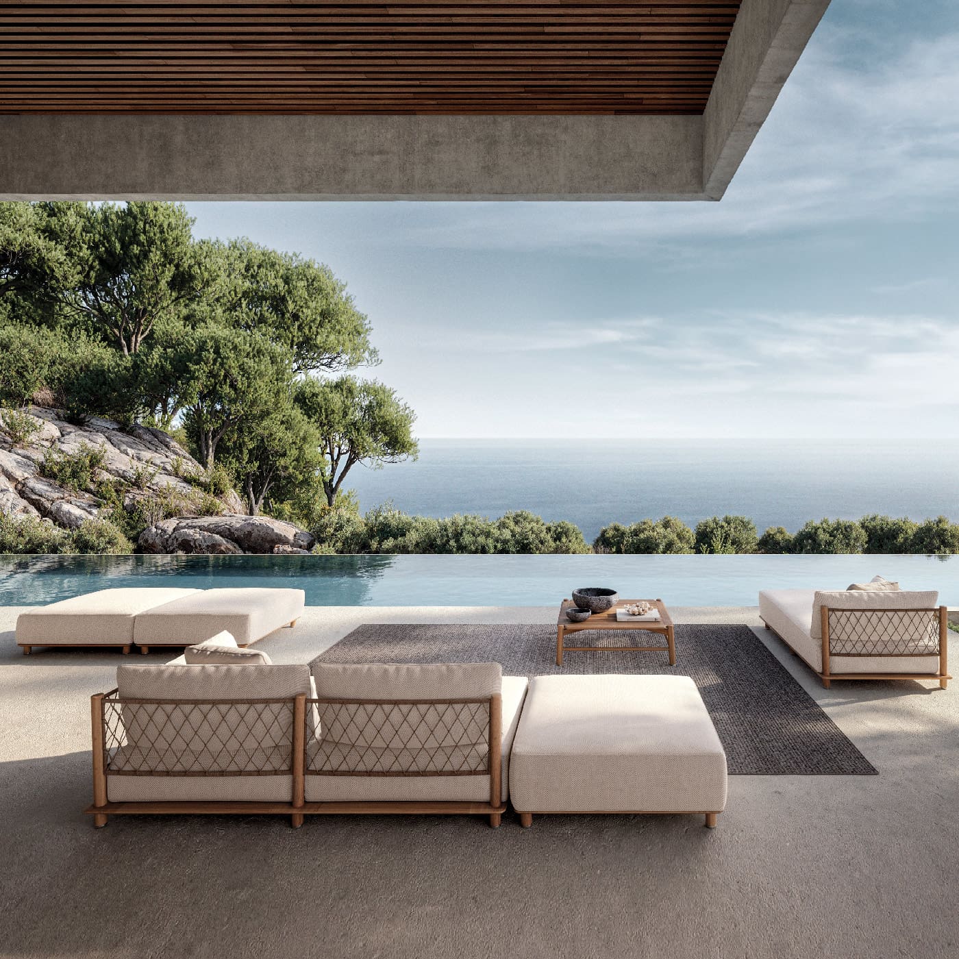 Image of wheat-coloued woven synthetic weave back of Gloster Salina garden sofa, with horizon swimming pool in the background