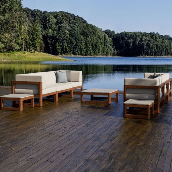 Image of Tuuci Sola luxury exterior sofas & lounge chairs on decking, with lake and woodland in the background
