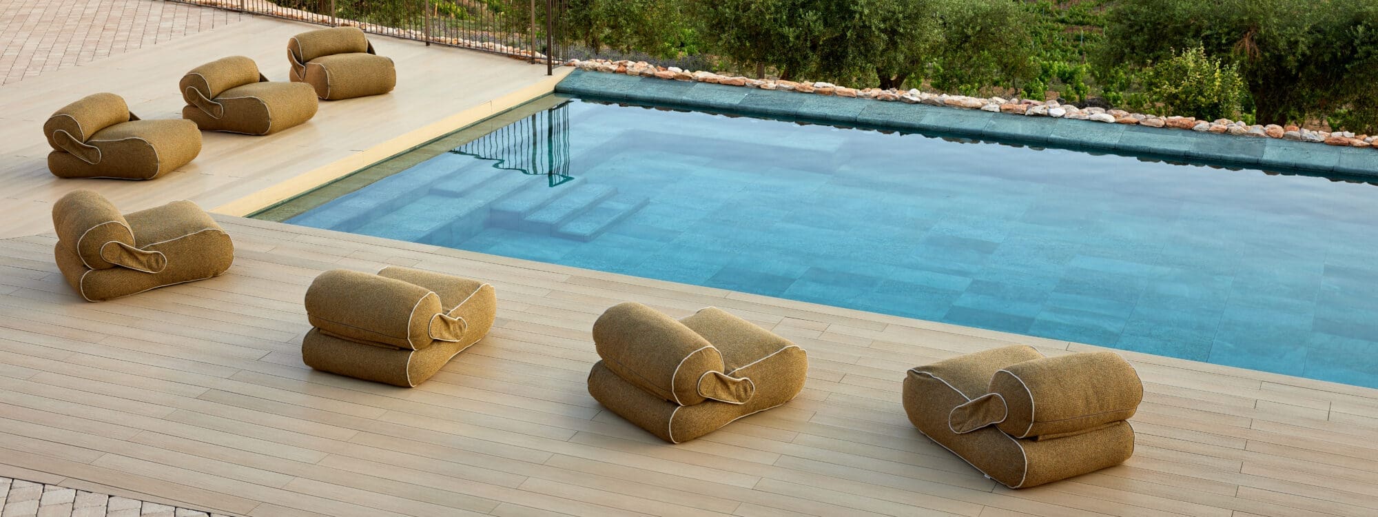 Image of Cane-line beanbags around a pool