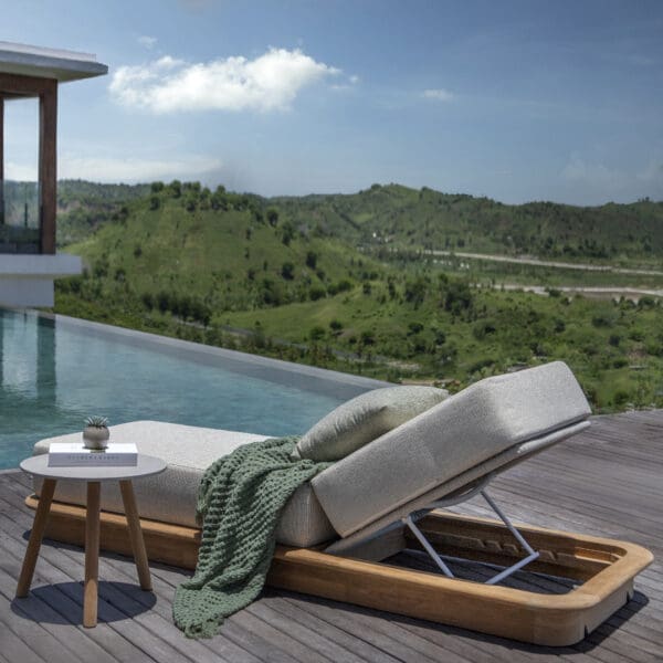 Image of Acri luxury sun bed next to horizon swimming pool with hot rolling hills in the background