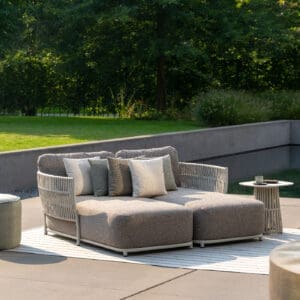 Image of pair of Cala luxury garden day beds with swimming pool in the background