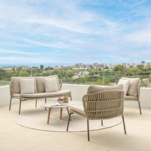 Image of Lima contemporary lounge chairs and sofa on a sunny terrace with blue sky in the background