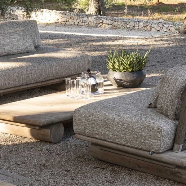 Image of Gommaire Jules luxury teak garden sofa and lounge chairs around Samba low tables