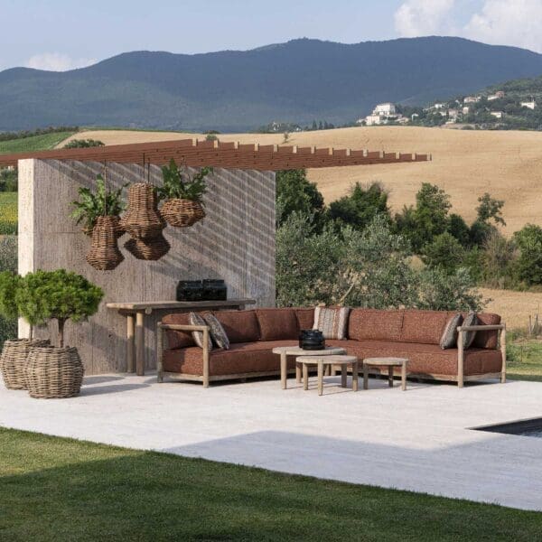 Image of Gommaire Mieke luxury teak sofa with villa and mountains in the background