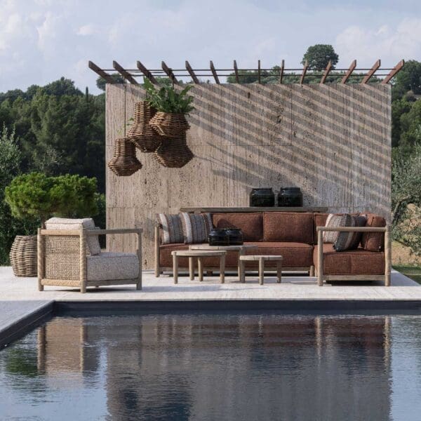 Image of Gommaire Mieke luxury teak sofa on poolside, with the furniture reflecting in the waters of the pool