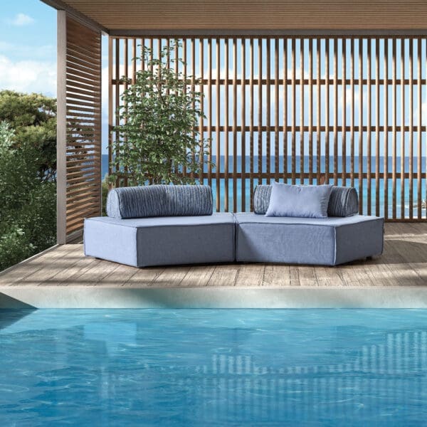 Image of Komoom light blue modern garden sofa on decking next to swimming pool