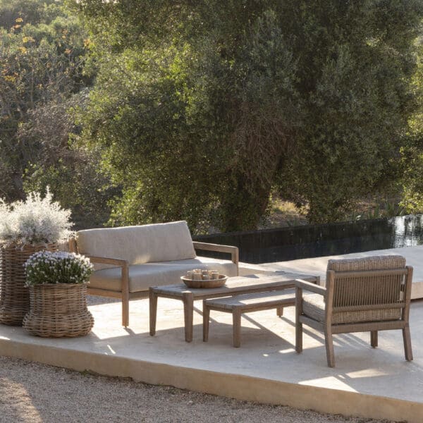 Image of Gommaire Mario luxury teak sofas on a terrace in gentle late afternoon sun