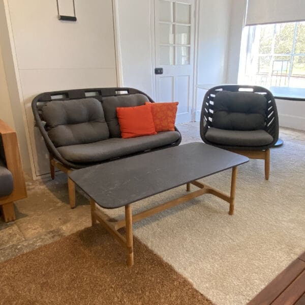 Image of Cane-line garden furniture sale items, including Strington lounge set and Twist ceramic coffee table