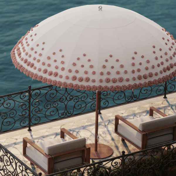 Image of Tuuci Image of the hand-made blossoms on the canopy of Tuuci Ombré Blossom luxury parasol above Tuuci Sail exterior lounge furniture