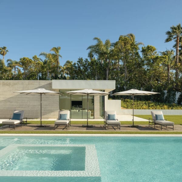 Image of row of Shademaker Libra parasols on sunny poolside