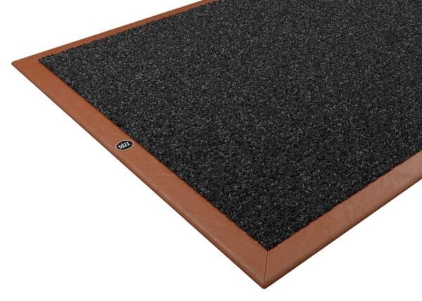 Studio imager of Rizz luxury indoor door mat with cognac leather surround