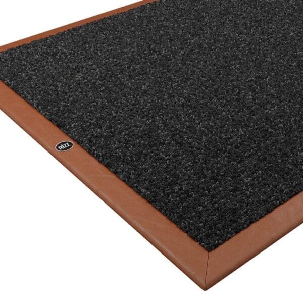 Studio imager of Rizz luxury indoor door mat with cognac leather surround