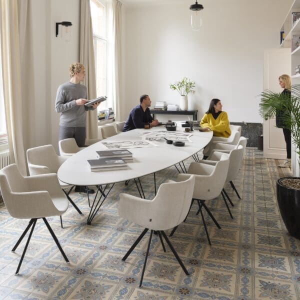 Image oi people sat and stood around Wire Majestic large elliptical table by Joli