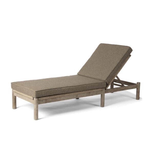 Studio image of Gommaire Mieke teak sunlounger with plump full-length cushion